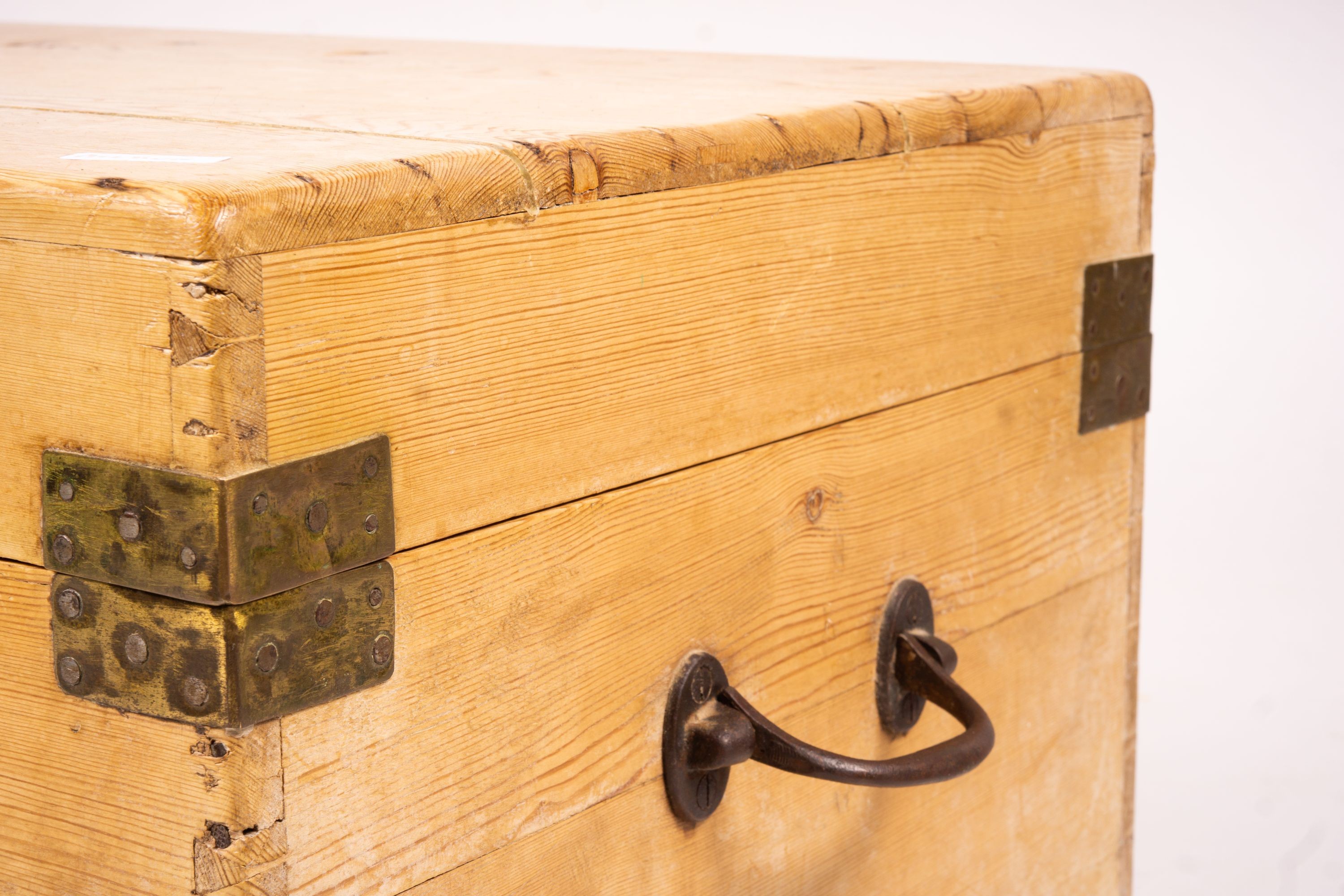 A small Victorian brass bound rectangular pine trunk, length 76cm, depth 46cm, height 42cm